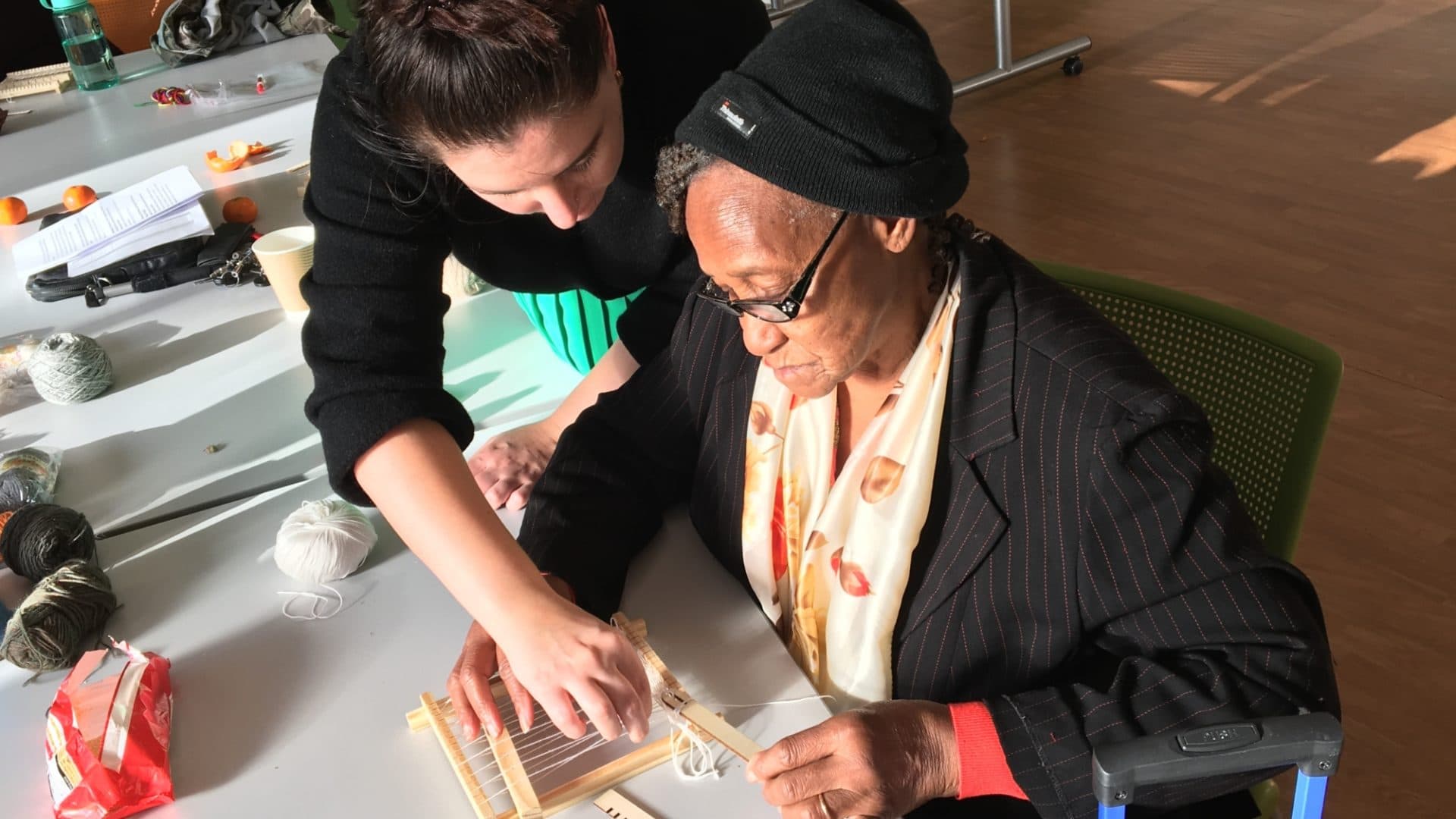 A woman assisting another woman