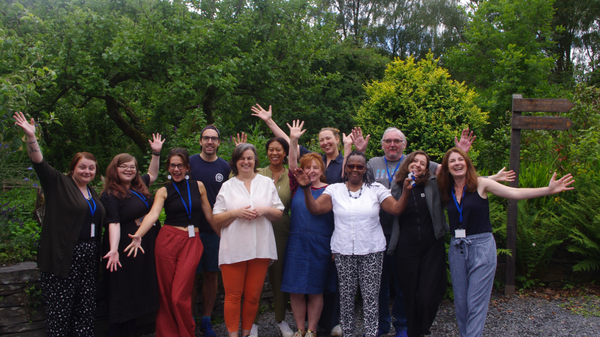 A group of smiling people at the Ripple Effect residential.