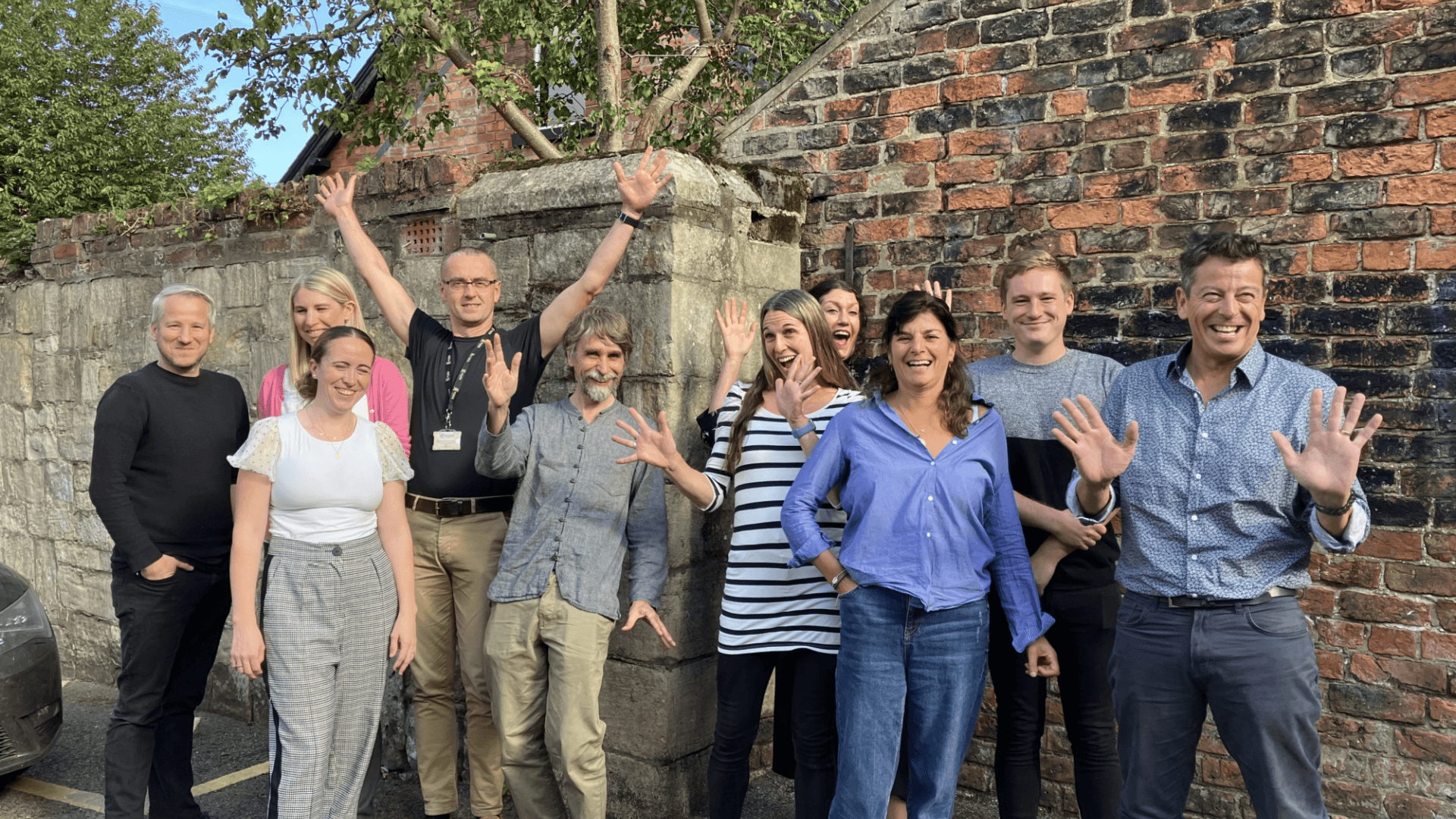 Group of people from York doing jazz hands