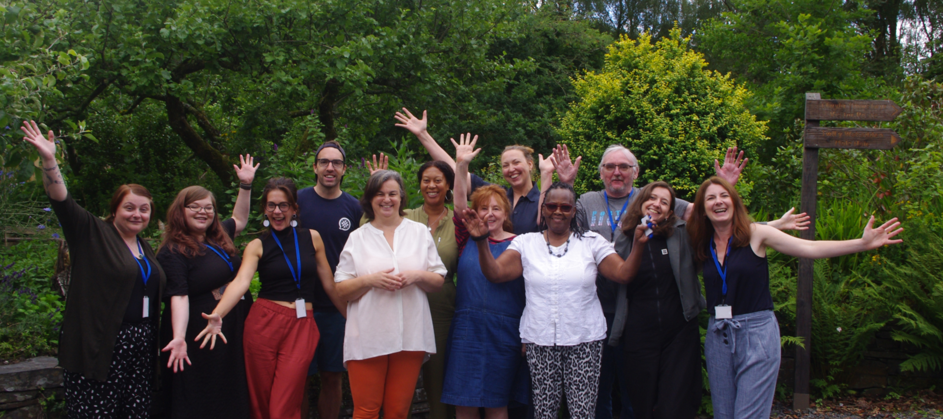 A group of smiling people at the Ripple Effect residential.